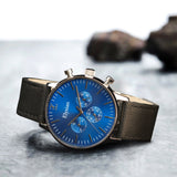 elysian-zilveren-heren-horloge-blauw-plaat-zwart-vintage-leder-horlogeband-ELYWM01020-second